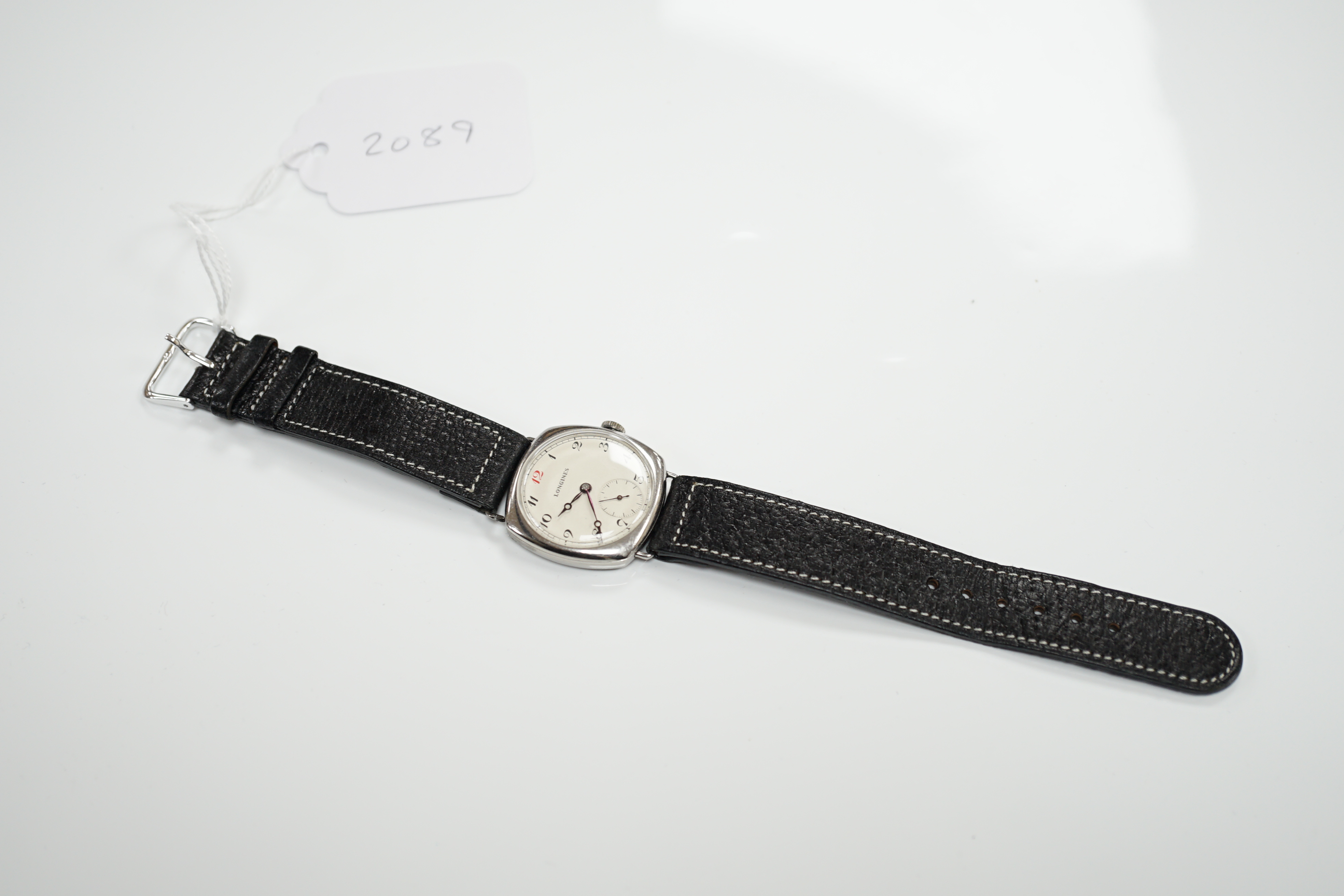 A gentleman's 1930's? stainless steel Longines manual wind wrist watch, with Arabic dial and subsidiary seconds, case diameter 32mm, on an associated leather strap.